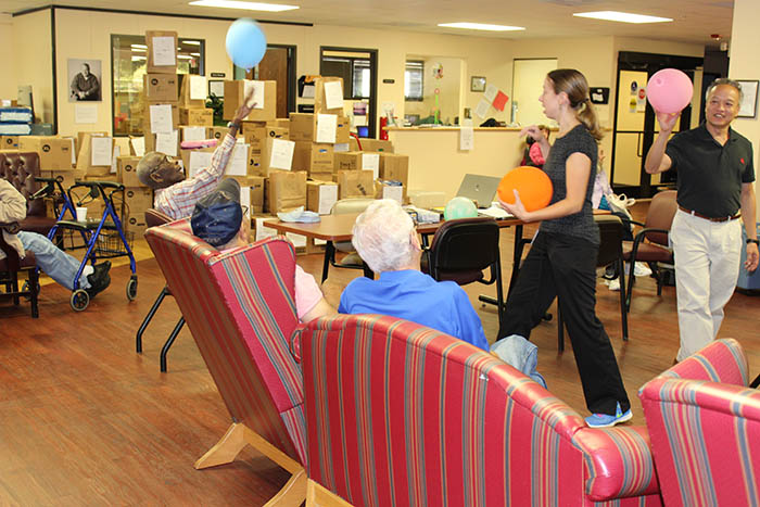 Anna Weinberg and Kheim Bui interacting with residents.