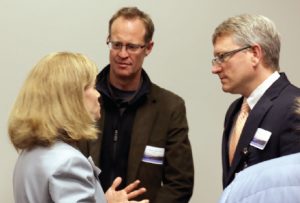 Dr. Julie Byerley speaks with Drs. Benjamin Gilmer and Blake Fagan after the program.