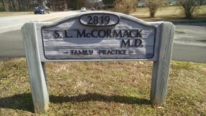 A sign welcoming visitor to Dr. Sandra McCormack's family practice in Tryon, North Carolina.